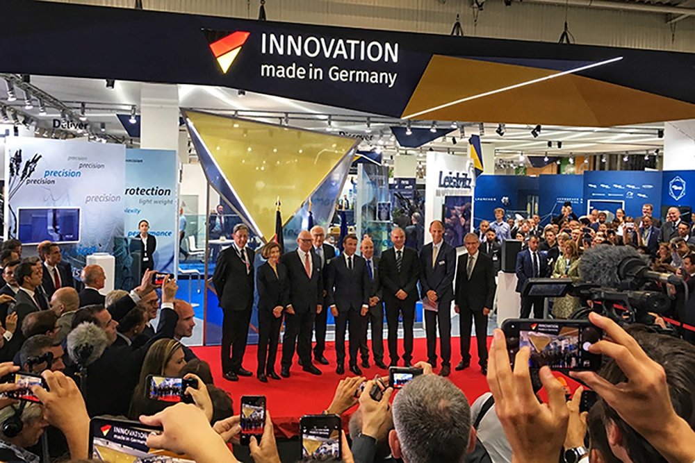 French President Macron visits German Pavilion and greets Liebherr staff during Paris Air Show 2019